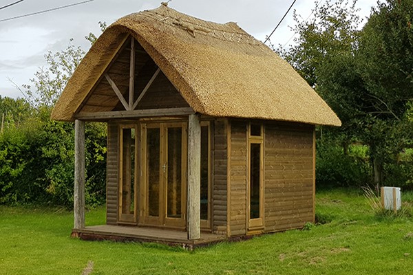 Thatched roof at Camelot Builders